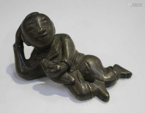 A Chinese Ming style brown patinated bronze figural scroll weight, possibly 18th century, modelled