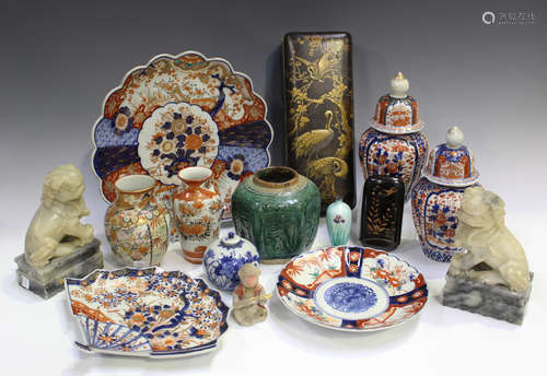 A group of Japanese Imari porcelain, Meiji period, comprising a pair of ovoid jars and domed covers,