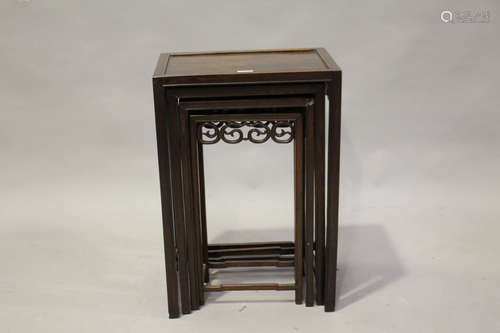 A Chinese hardwood quartetto nest of occasional tables, early 20th century, each rectangular