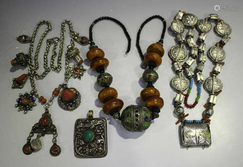 A group of Eastern jewellery, including a Tibetan enamelled and amber bead necklace, length 54cm,