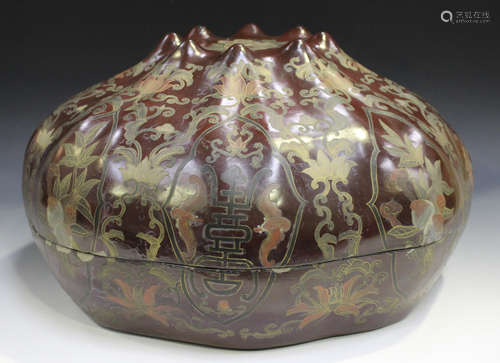 A Chinese lacquer box and cover, late Qing dynasty, of pomegranate form, the top and sides painted