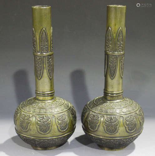 A pair of Chinese brown patinated bronze bottle vases, late Qing dynasty, each globular body cast