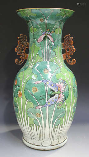 A Chinese famille rose porcelain vase, late Qing dynasty, the baluster body painted with butterflies