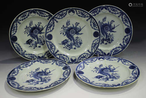 A set of five Chinese blue and white export porcelain plates, 18th century, painted with a central