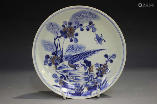 A Chinese underglaze blue and red porcelain circular dish, mark of Kangxi but later, painted with