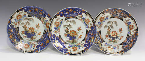 A set of four Chinese Imari export porcelain plates, Kangxi period, each painted and gilt with a