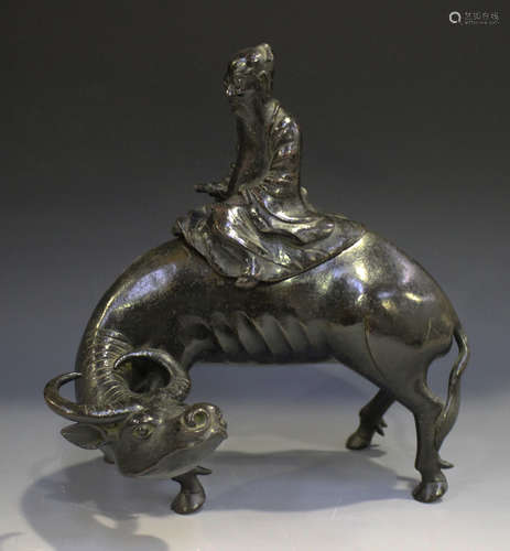 A Chinese brown patinated bronze censer and cover, late Ming dynasty, modelled as a sage seated on