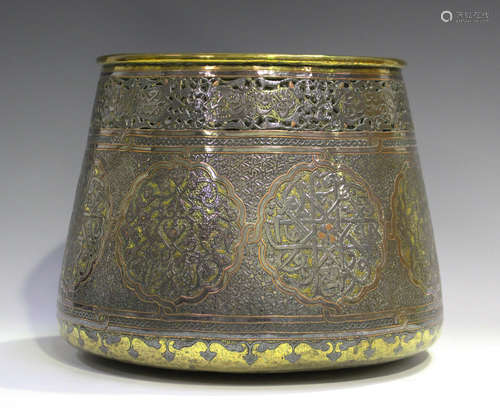 An Islamic Cairo ware brass jardinière, early 20th century, overlaid in silver and copper with a