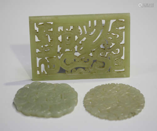 Three Chinese carved and pierced jade plaques, early 20th century, comprising a rectangular panel,