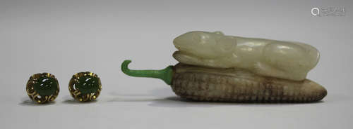 A Chinese jade snuff bottle, 20th century, carved in the form of a mouse lying upon a corn cob,