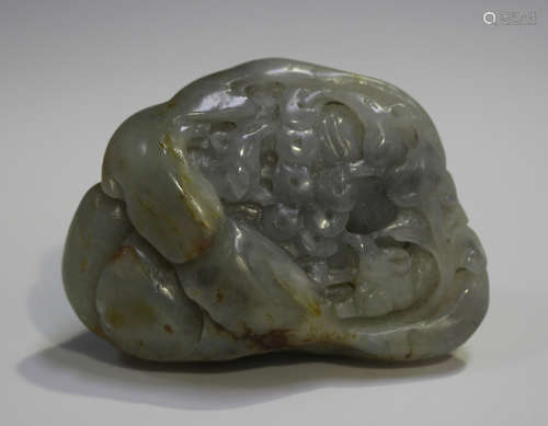 A Chinese pebble jade carving, early 20th century, one side carved in low relief with two rams