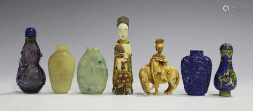 A group of five Chinese snuff bottles, 20th century, including a lapis lazuli bottle with carved