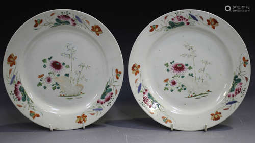 A pair of Chinese famille rose export porcelain plates, Qianlong period, painted with flowers,