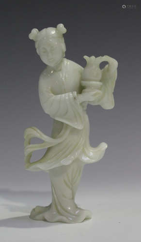 A Chinese carved white jadeite figure of a maiden, 20th century, modelled standing with flowing