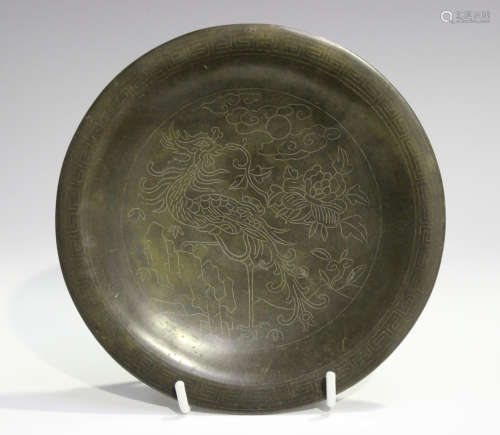 A Chinese wire inlaid bronze circular dish, Qing dynasty, the central panel finely inlaid with a