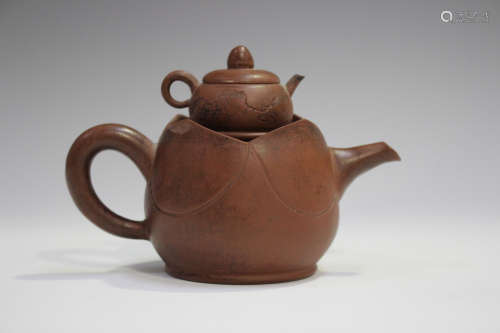 A Chinese Yixing stoneware teapot, 20th century, with cover of diminutive teapot form with lid and