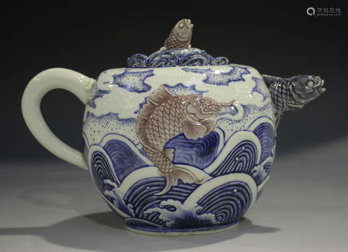 A Japanese underglaze blue and red porcelain teapot and cover by Makuzu Kozan, Meiji period, the