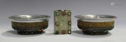 A pair of Tibetan white metal mounted burlwood bowls, late 19th/early 20th century, each underside