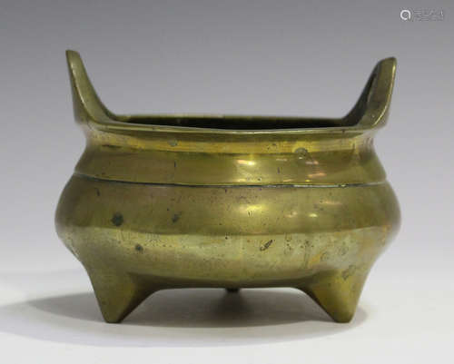 A Chinese bronze tripod censer, mark of Xuande but late Qing dynasty, of circular bombé form with