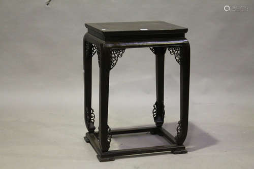 A Chinese hardwood stand, 20th century, the rectangular panelled top above slightly curved legs with