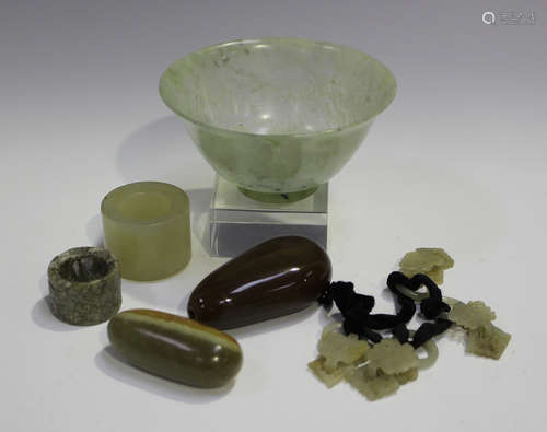 A Chinese pebble jade snuff bottle, late Qing dynasty, the stone of celadon and russet tone,