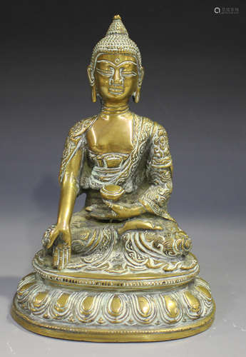 A Sino-Tibetan bronze figure of Buddha, late 19th/20th century, modelled seated in dhyanasana on a