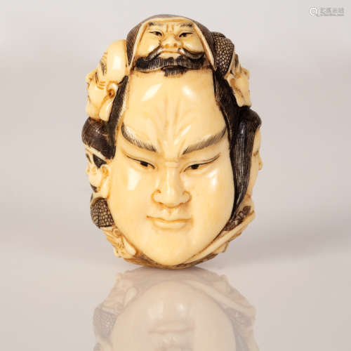 fine signed netsuke of carved faces early 1900's Japan
