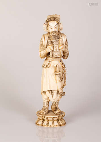 Chinese Bone Sculpture in the Figure of a Warrior with a Sword Holding a Scroll in His Hands