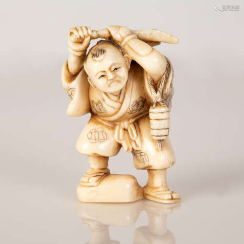 signed netsuke of boy holding an 