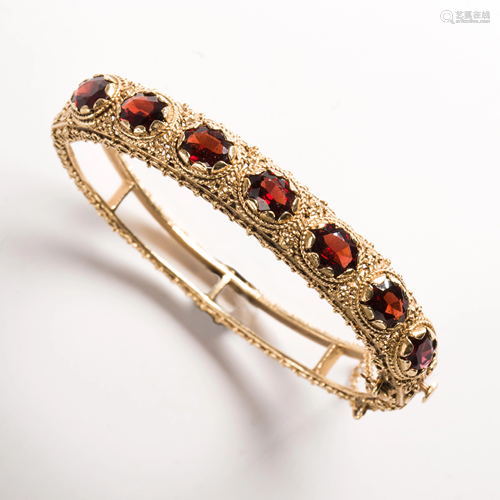 A Victorian Revival garnet and fourteen karat gold