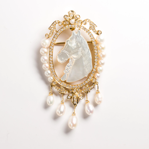 A pearl, diamond and fourteen karat gold brooch