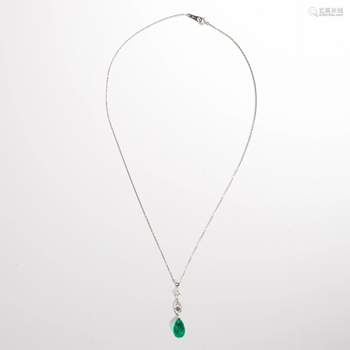 An emerald, diamond and fourteen karat gold pendant