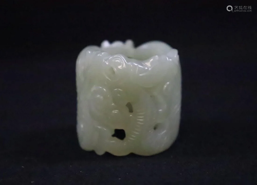 An Unusual Chinese Celadon Jade Archer's Ring carved in