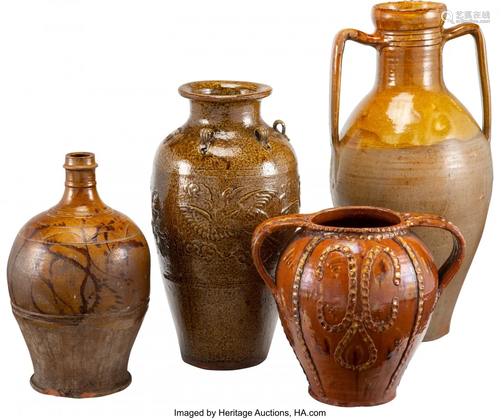 63160: A Group of Four Glazed Earthenware Floor Vases,