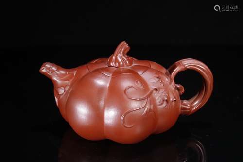 A Zisha Teapot With Flower Pattern