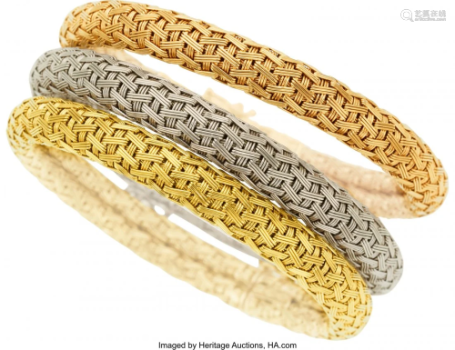 55012: Gold Bracelets The trio of 18k white, yellow an