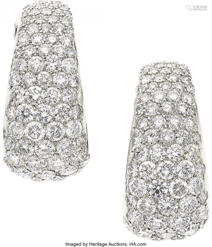 55067: Diamond, Platinum Earrings The earrings feature