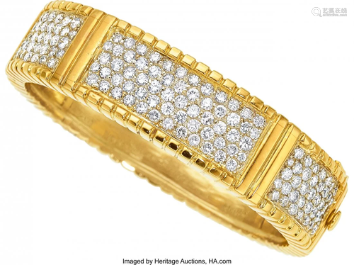 55236: Diamond, Gold Bracelet The hinged bangle featu