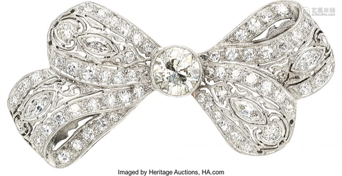 55086: Diamond, White Gold Brooch The bow brooch featu