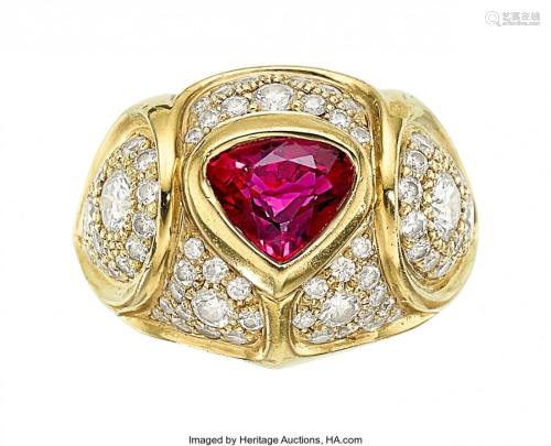 55366: Ruby, Diamond, Gold Ring The ring features a tr