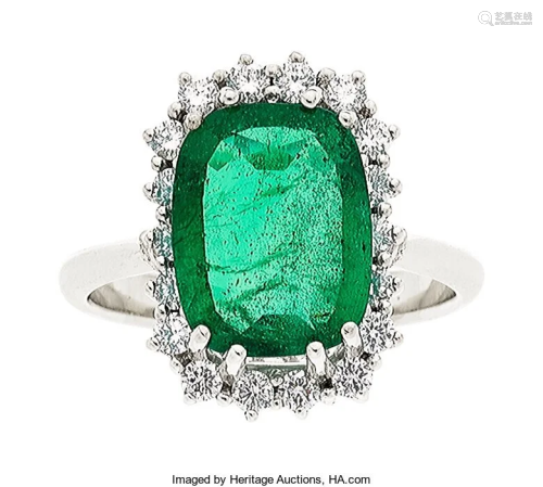 55338: Emerald, Diamond, White Gold Ring The ring cent