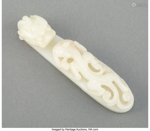 67052: A Chinese Carved Pale Celadon Jade Qilong Buckle