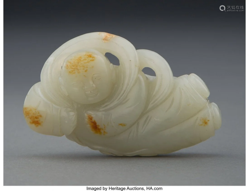 67037: A Chinese Carved Pale Celadon Jade Reclining Fig