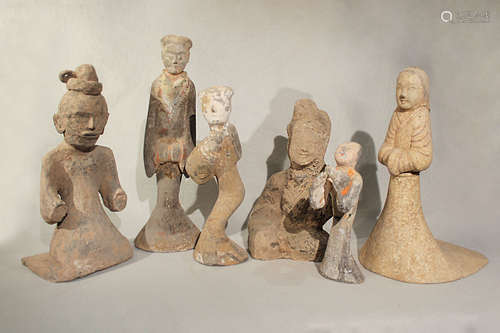 A group of six Chinese painted grey pottery figures,