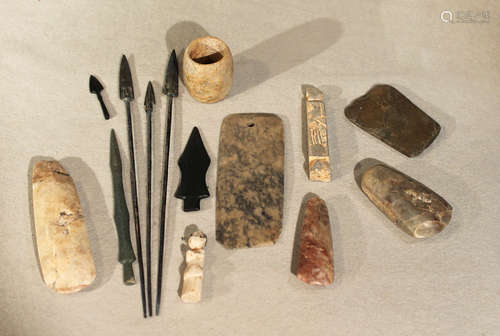 A group of assorted Chinese and other stone axe heads, bronze arrowheads & miscellanea,