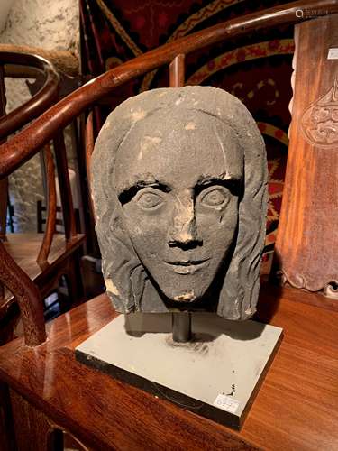 A carved stone head, in medieval style, 19th century, probably English,