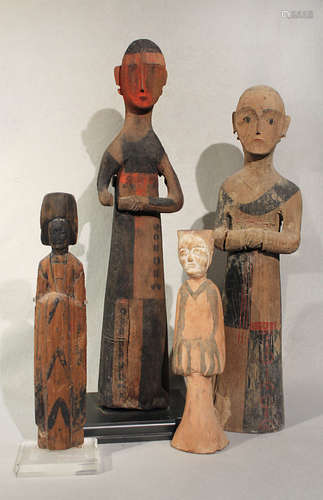 A group of four Chinese carved and painted wood tomb figures, in Han Dynasty style,