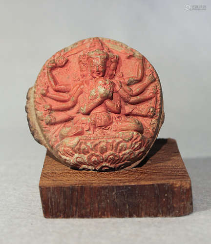 A Tibetan stucco votive tablet depicting Mahayama with Dakini on a lotus, 19th century,