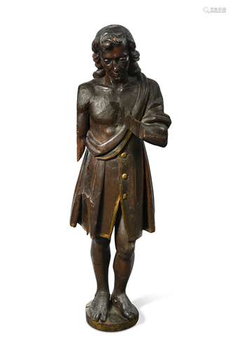 A carved softwood figure of a man, possibly 17th century,