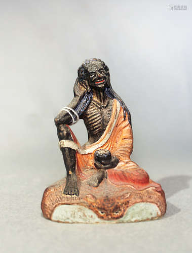 A Tibetan painted plaster figure of Milarepa fasting, 19th century,